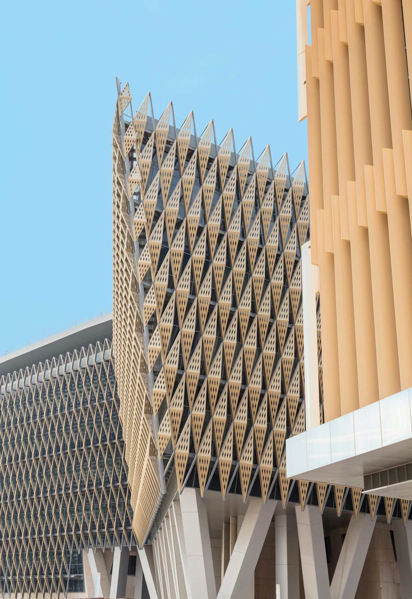 A modern facade with a deep lattice of precast panels.