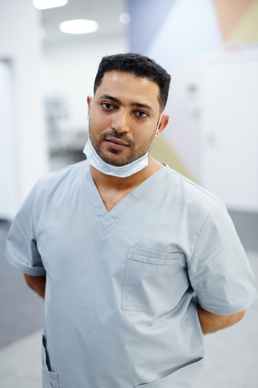 Priya Raman, in scrubs in the practice corridor.
