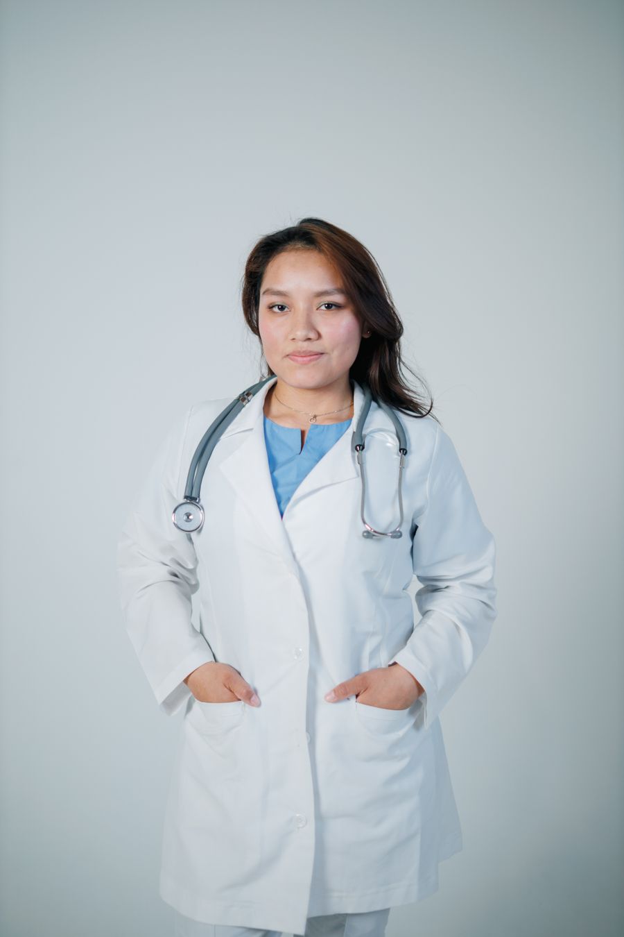 Portrait of Dr Amara Sedillo in a white coat.