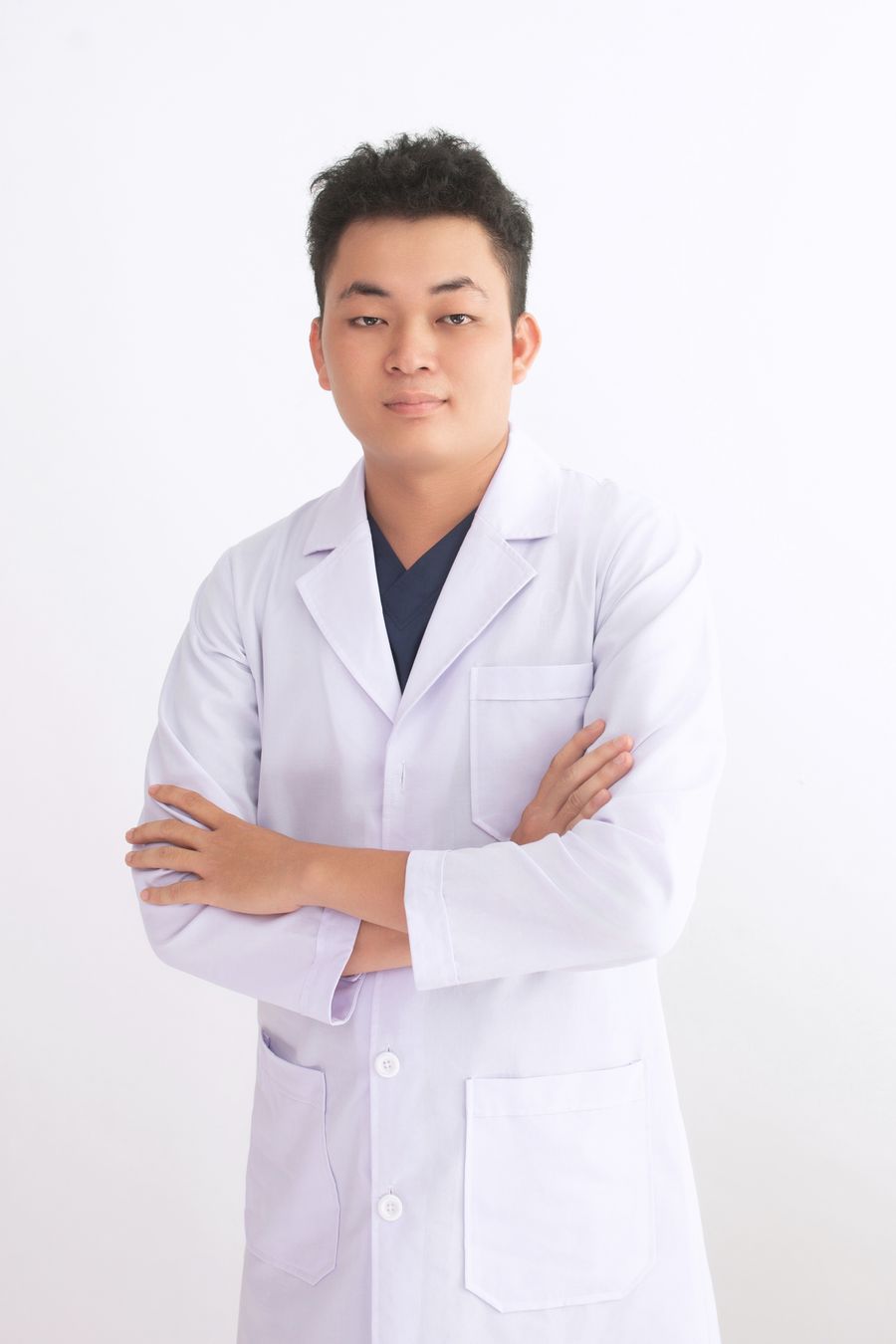 Portrait of Dr Wren Halloway in a white coat.