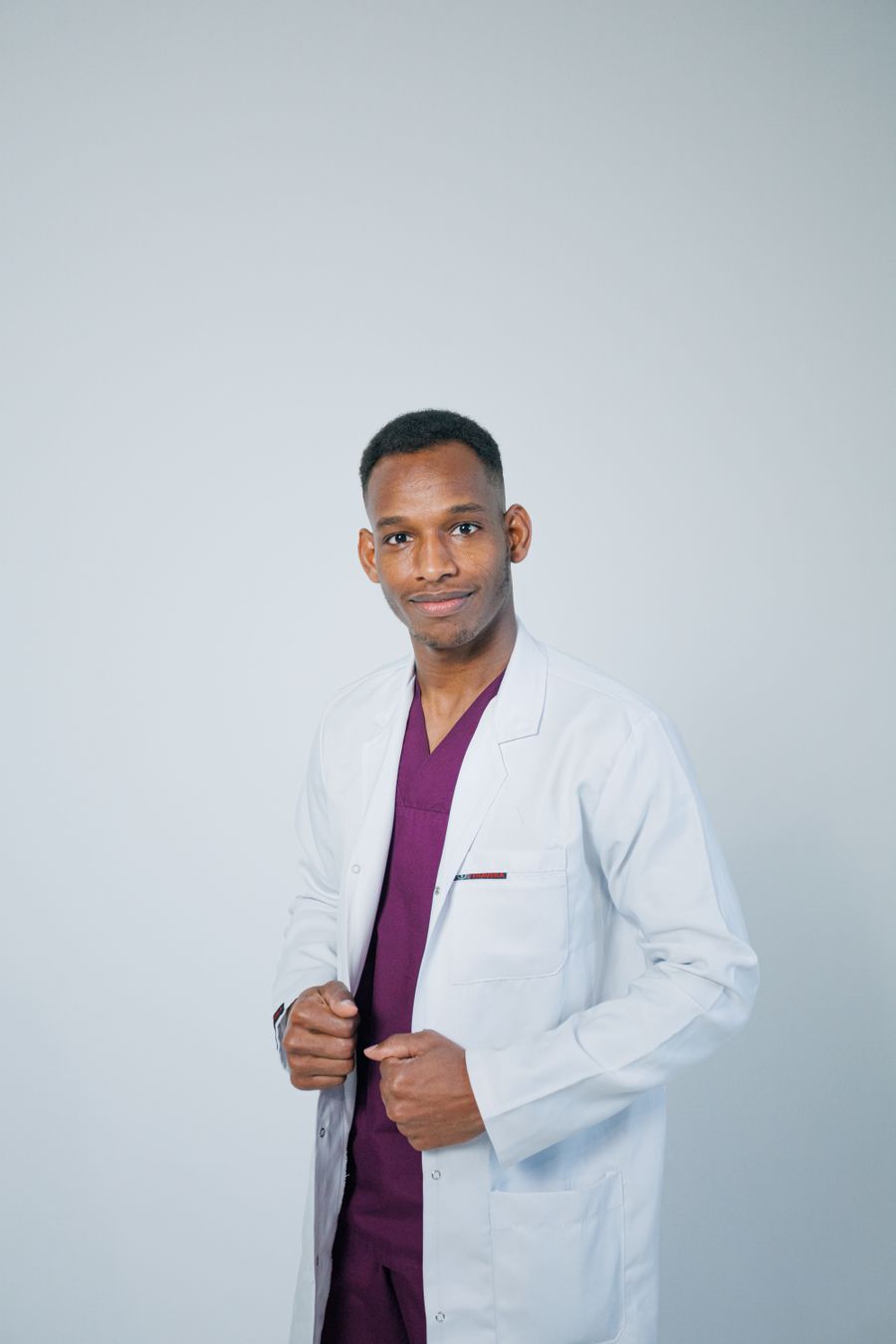 Portrait of Elias Marchetti in a white clinic coat.